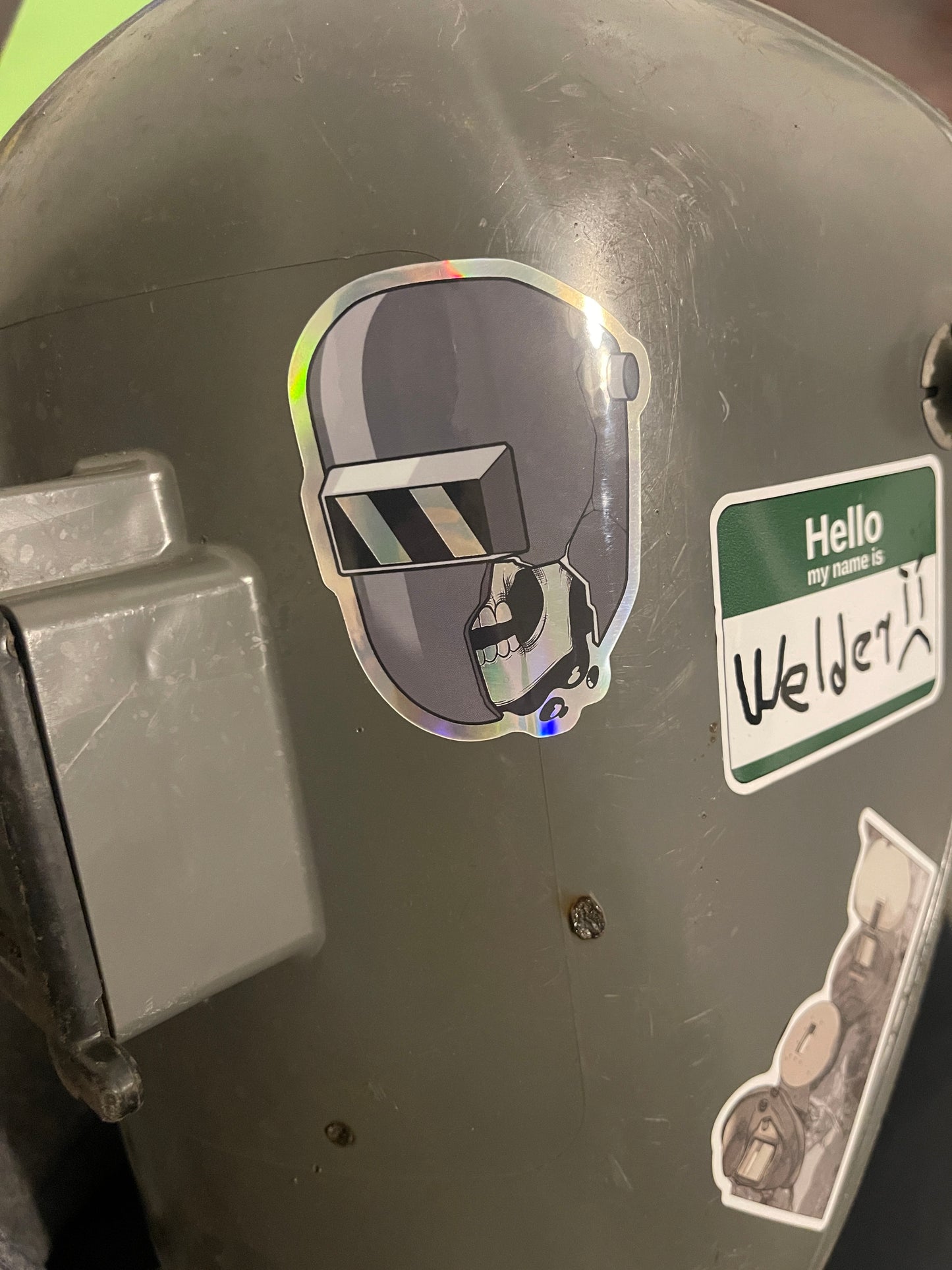 Shattered welding hood with skull holographic sticker